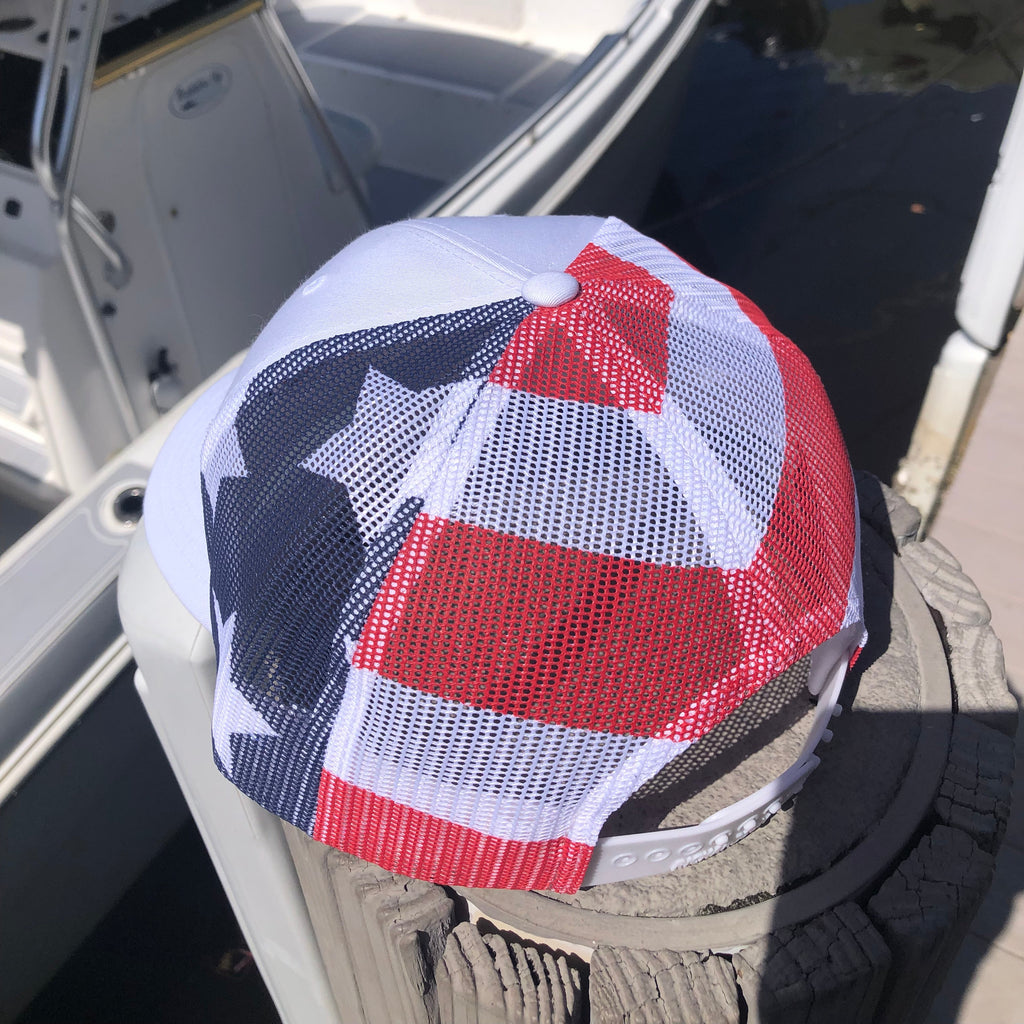 Red, white, and blue mesh cap on a boat's seat